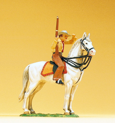 Cowboy zu Pferd mit Gewehr